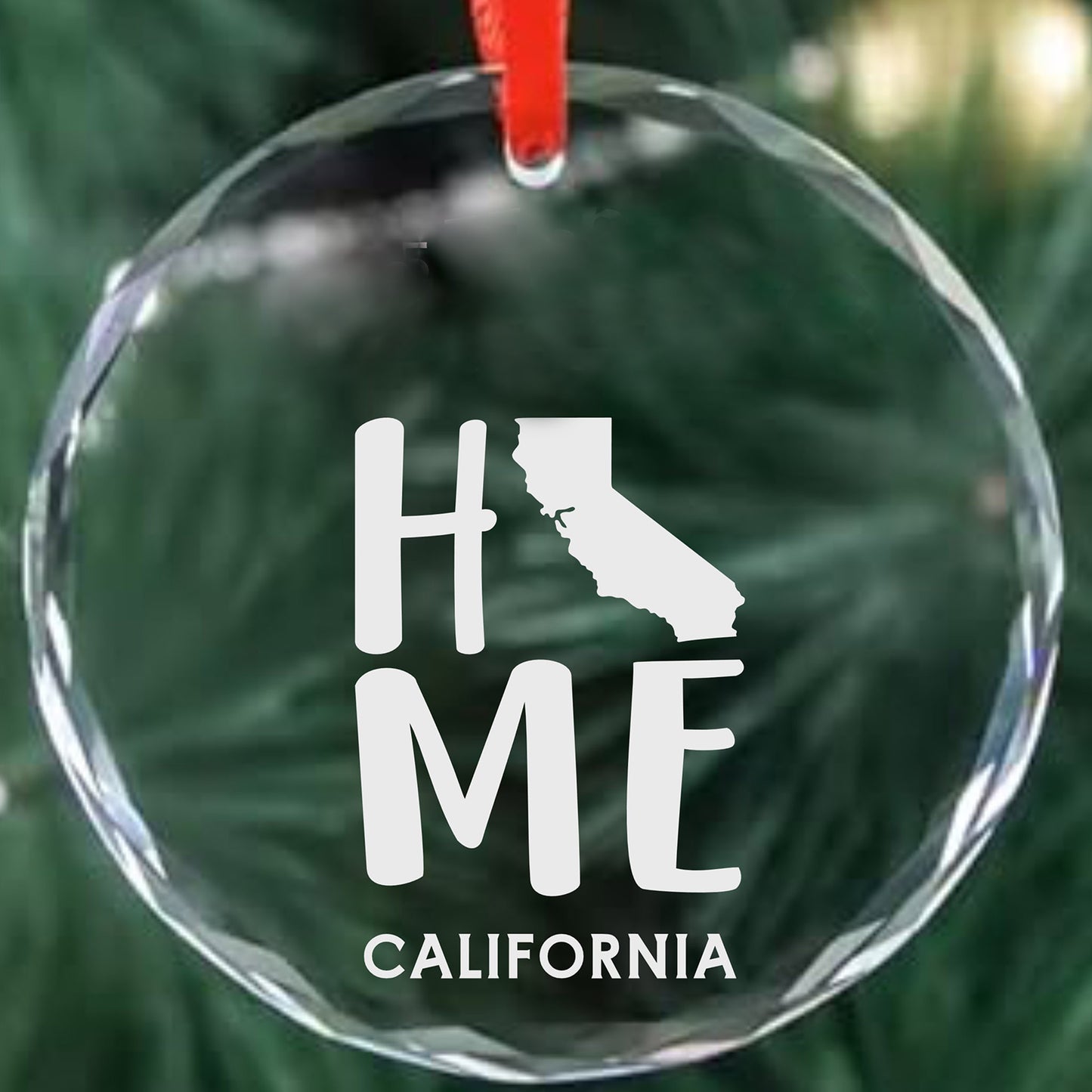 Clear glass ornament laser engraved with California outline, HOME text and personalized family name