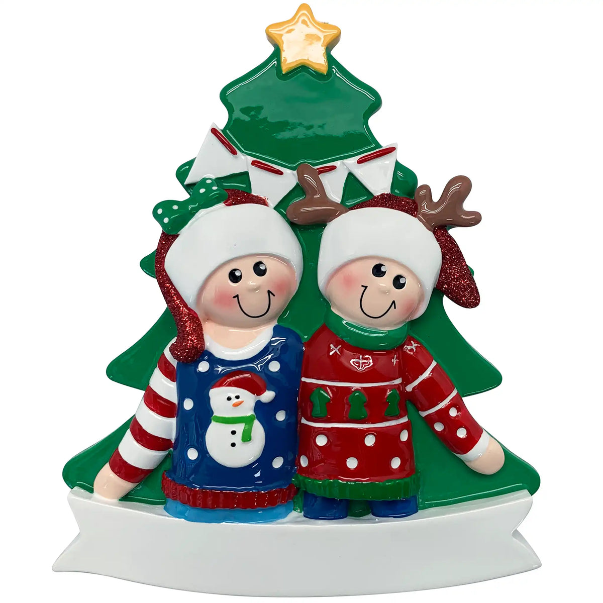 A personalized Christmas ornament of a couple in colorful ugly sweaters in front of a Christmas tree, featuring a white banner for custom engraving.