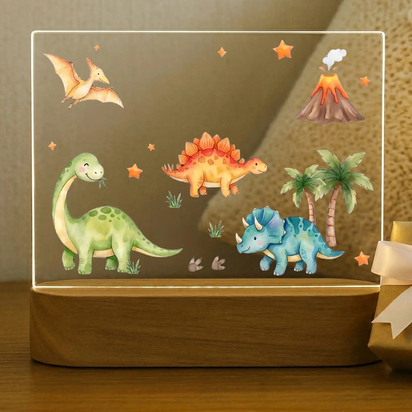 Personalized dinosaur night light for kids with brachiosaurus, stegosaurus, triceratops, and pterodactyl on an acacia wood base