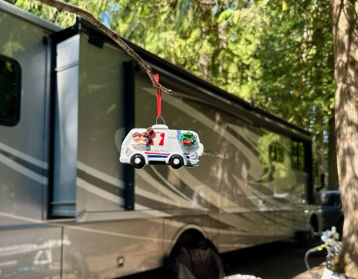 A travel camper, a bicycle, and a personalized RV ornament from My Ornament.