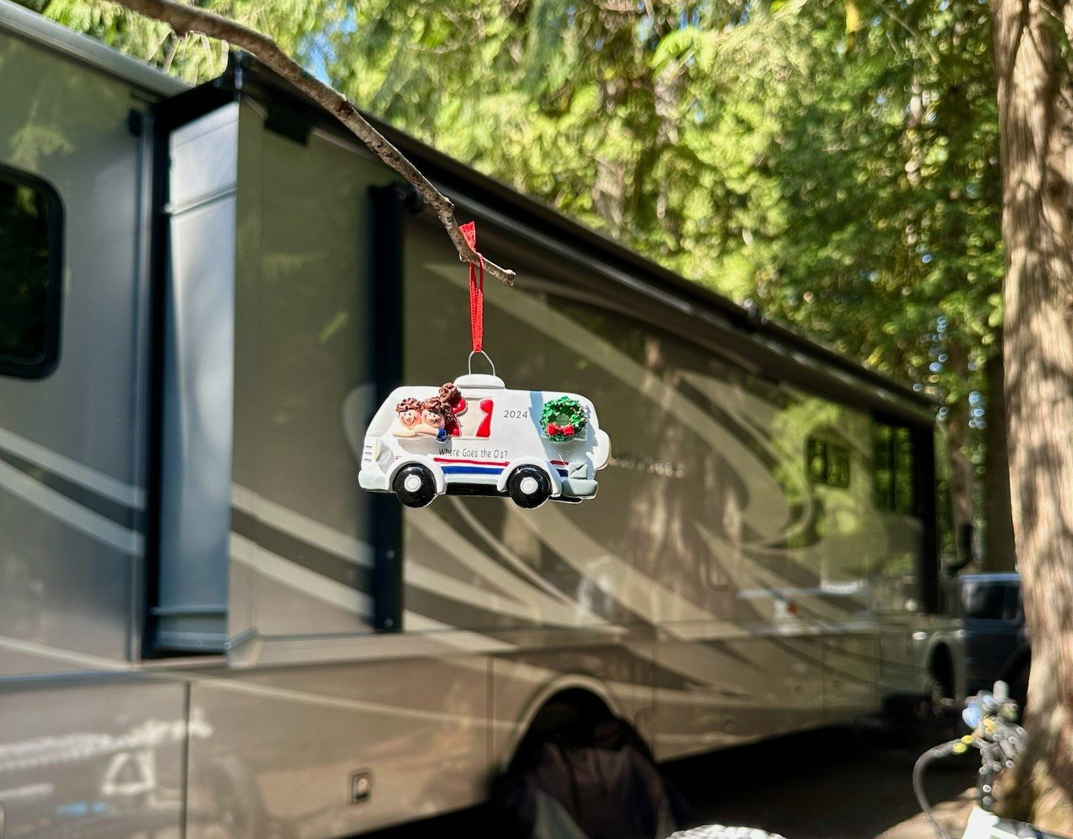 A travel camper, a bicycle, and a personalized RV ornament from My Ornament.