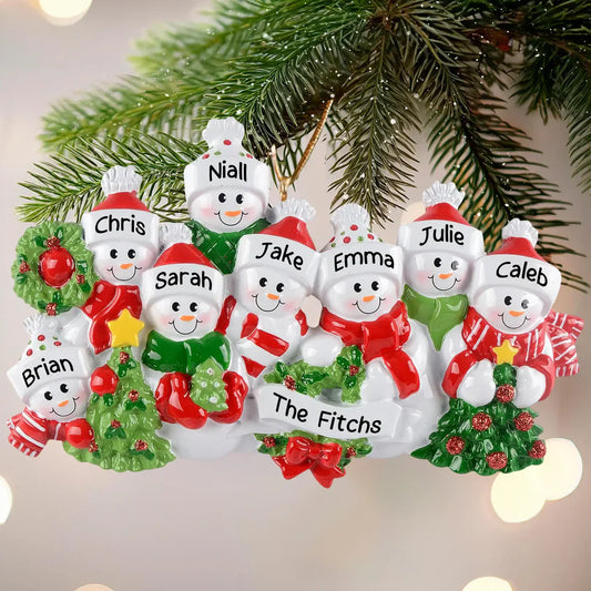 MyOrnament personalized snowman family ornament with seven custom names and family name hanging on a tree.