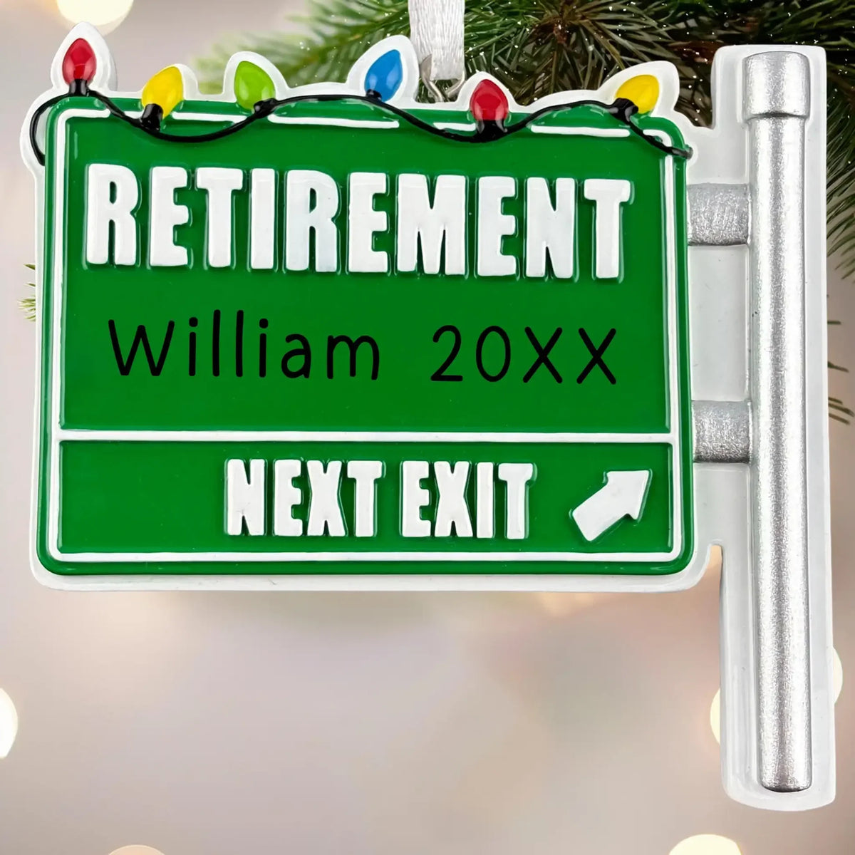 MyOrnament retirement sign ornament personalized with William and 20XX, with holiday lights and a “Next Exit” message.
