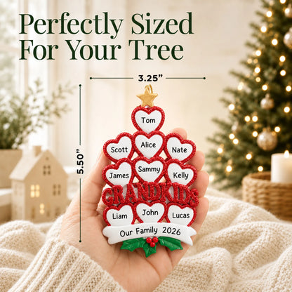 Size guide: the personalized grandkids 10 hearts christmas ornament is 3.25 in wide by 5.50 in tall, shown in hand