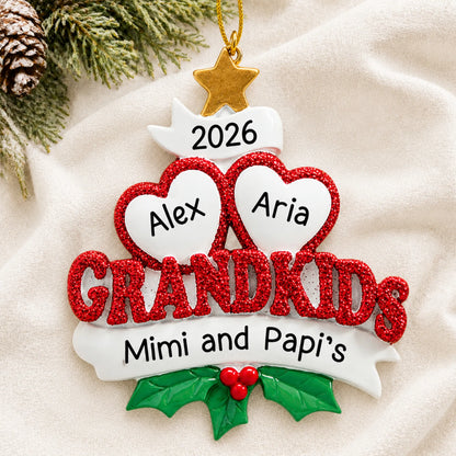 Personalized grandkids 2 hearts christmas ornament laid on a soft white knit blanket