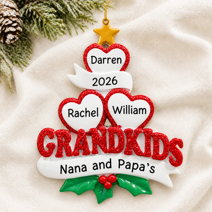 Personalized grandkids 3 hearts christmas ornament laid on a soft white knit blanket