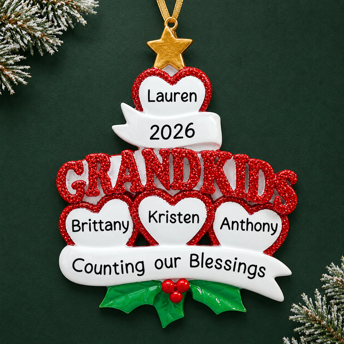 Personalized grandkids 4 hearts christmas ornament on a dark green pine background