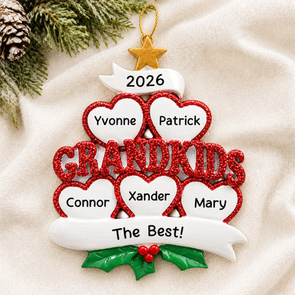 Personalized grandkids 5 hearts christmas ornament laid on a soft white knit blanket