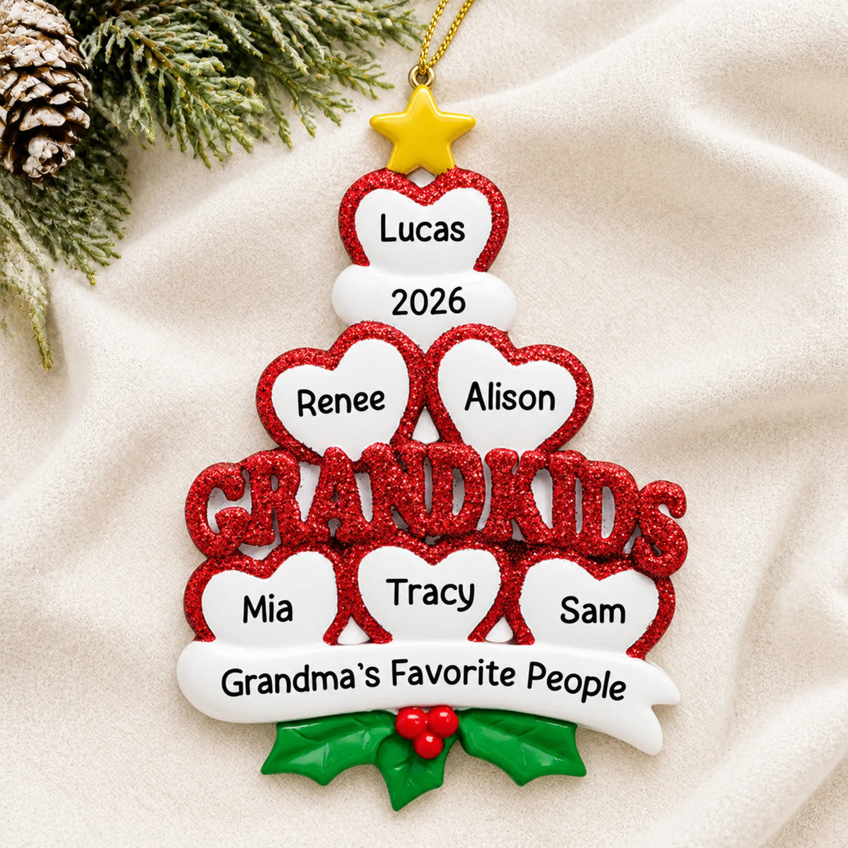 Personalized grandkids 6 hearts christmas ornament laid on a soft white knit blanket