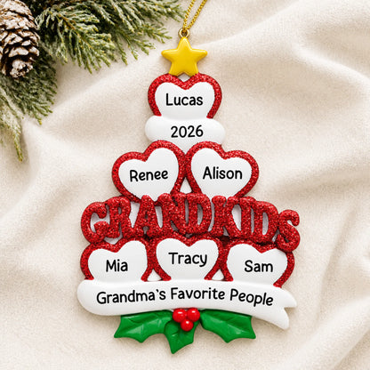 Personalized grandkids 6 hearts christmas ornament laid on a soft white knit blanket