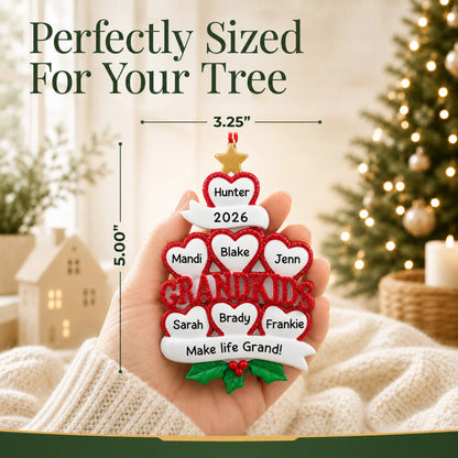Size guide: the personalized grandkids 7 hearts christmas ornament is 3.25 in wide by 5.00 in tall, shown in hand