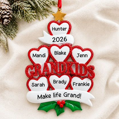 Personalized grandkids 7 hearts christmas ornament laid on a soft white knit blanket