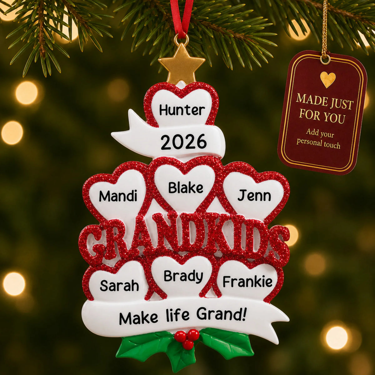 Grandkids 7 hearts christmas ornament hanging on a lit Christmas tree with a Made Just For You gift tag