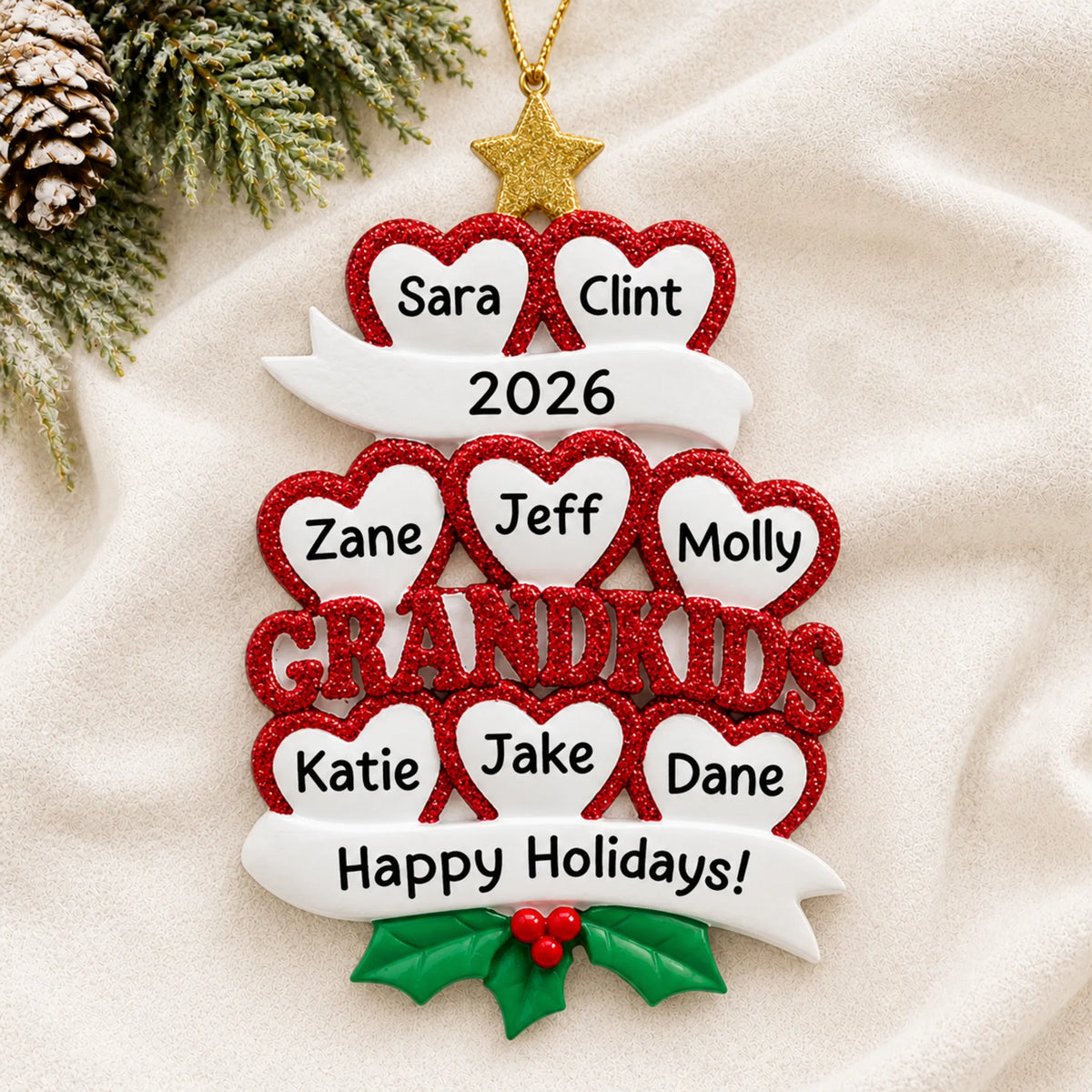 Personalized grandkids 8 hearts christmas ornament laid on a soft white knit blanket