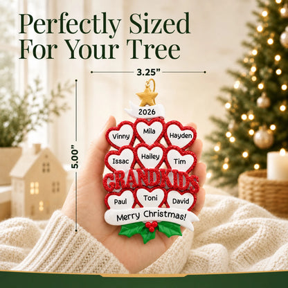 Size guide: the personalized grandkids 9 hearts christmas ornament is 3.25 in wide by 5.00 in tall, shown in hand