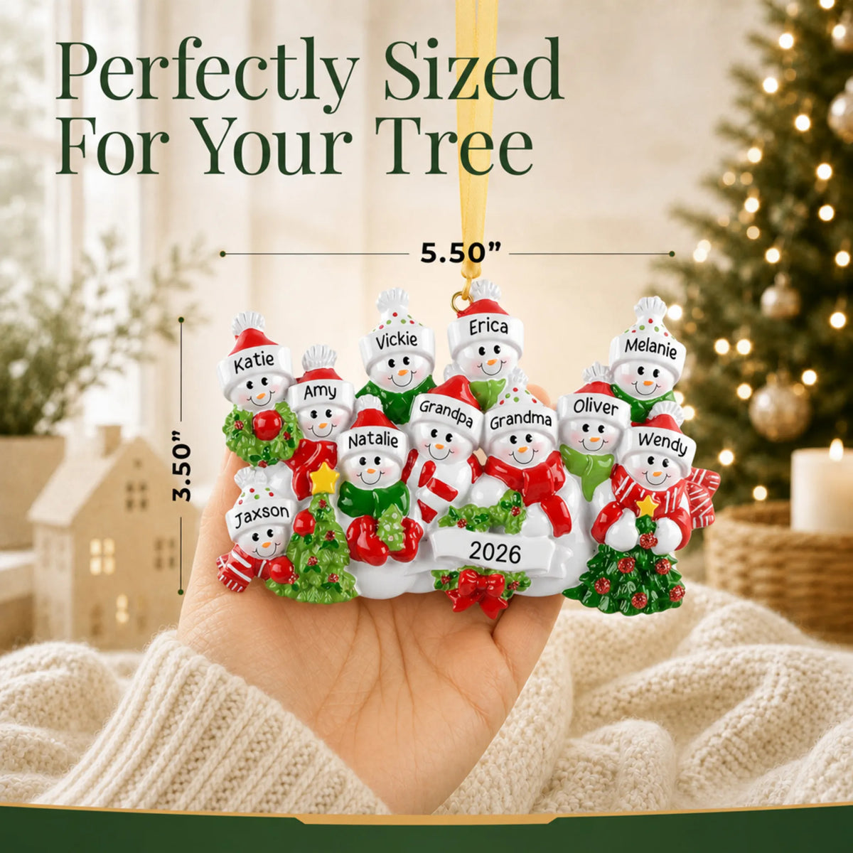 Size guide: the personalized snowman family of 11 christmas ornament is 5.50 in wide by 3.50 in tall, shown in hand