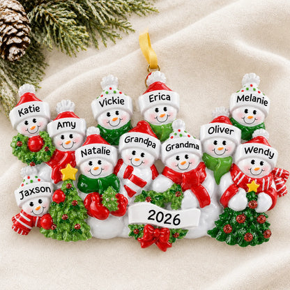 Personalized snowman family of 11 christmas ornament laid on a soft white knit blanket