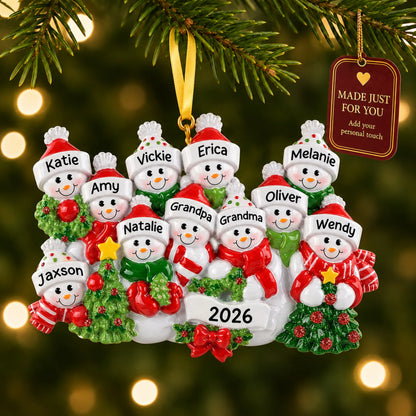 Snowman family of 11 christmas ornament hanging on a lit Christmas tree with a Made Just For You gift tag