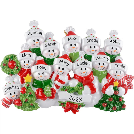 Personalized Christmas ornament featuring a large group of twelve snowmen decorated with red and green scarves and hats, holding miniature trees and garland, ready for custom name engraving.