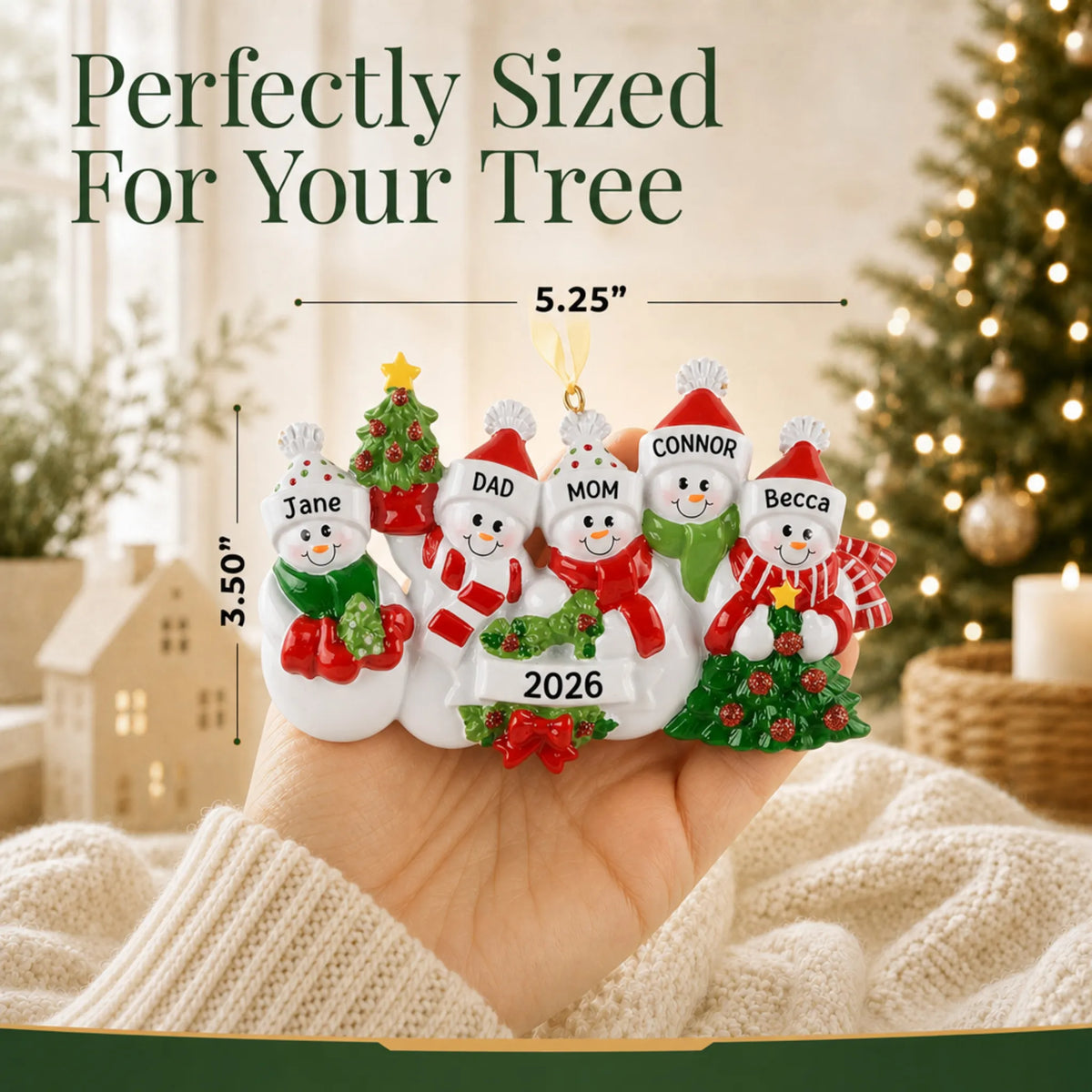 Size guide: the personalized snowman family of 5 christmas ornament is 5.25 in wide by 3.50 in tall, shown in hand