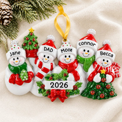 Personalized snowman family of 5 christmas ornament laid on a soft white knit blanket