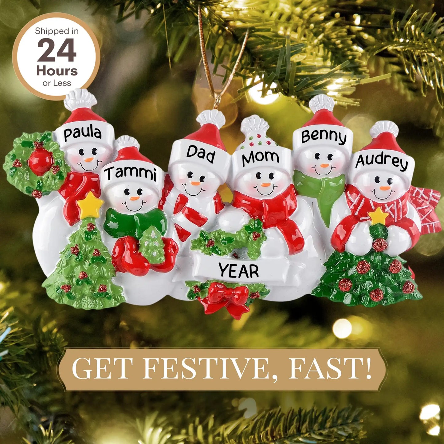 Personalized snowman family Christmas ornament with names on a tree.