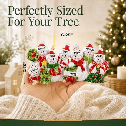 Size guide: the personalized snowman family of 7 christmas ornament is 6.25 in wide by 3.75 in tall, shown in hand