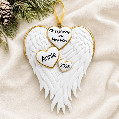 Personalized Christmas In Heaven Memorial christmas ornament laid on a soft white knit blanket
