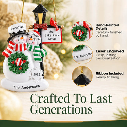 Hand-painted details and laser engraved personalization on the snowman couple lamppost christmas ornament, ribbon included