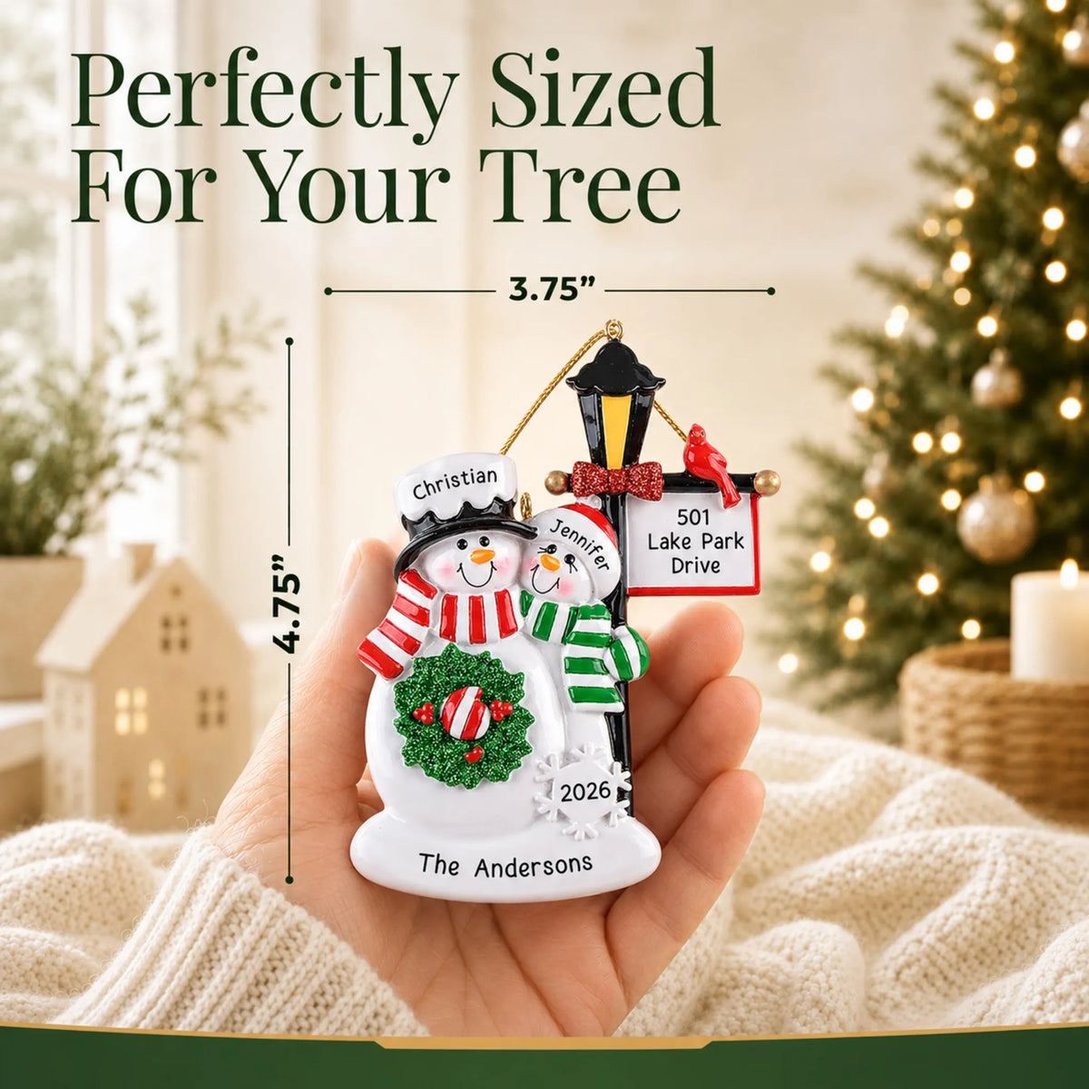 Size guide: the personalized snowman couple lamppost christmas ornament is 3.75 in wide by 4.75 in tall, shown in hand