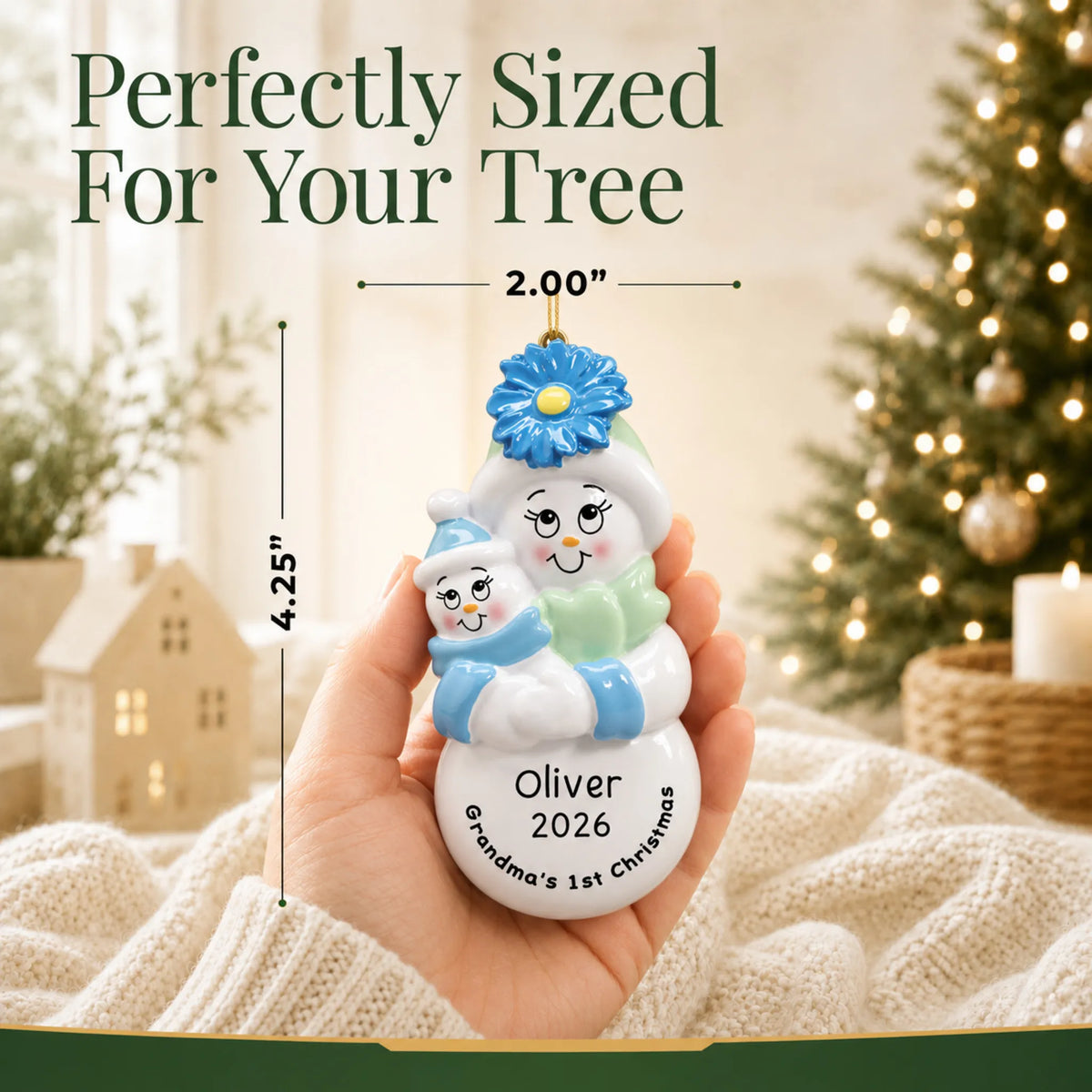Size guide: the personalized grandma's 1st christmas ornament shown in hand next to a Christmas tree