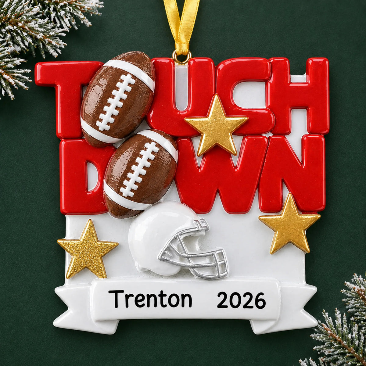 Personalized football touchdown christmas ornament on a dark green pine background