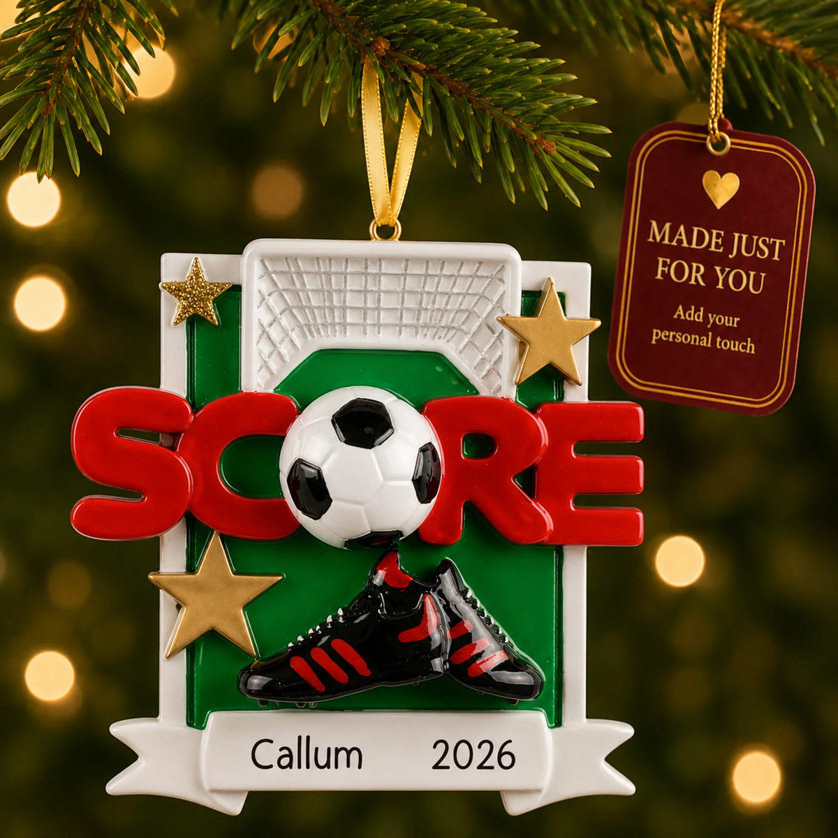 Soccer score christmas ornament hanging on a lit Christmas tree with a Made Just For You gift tag