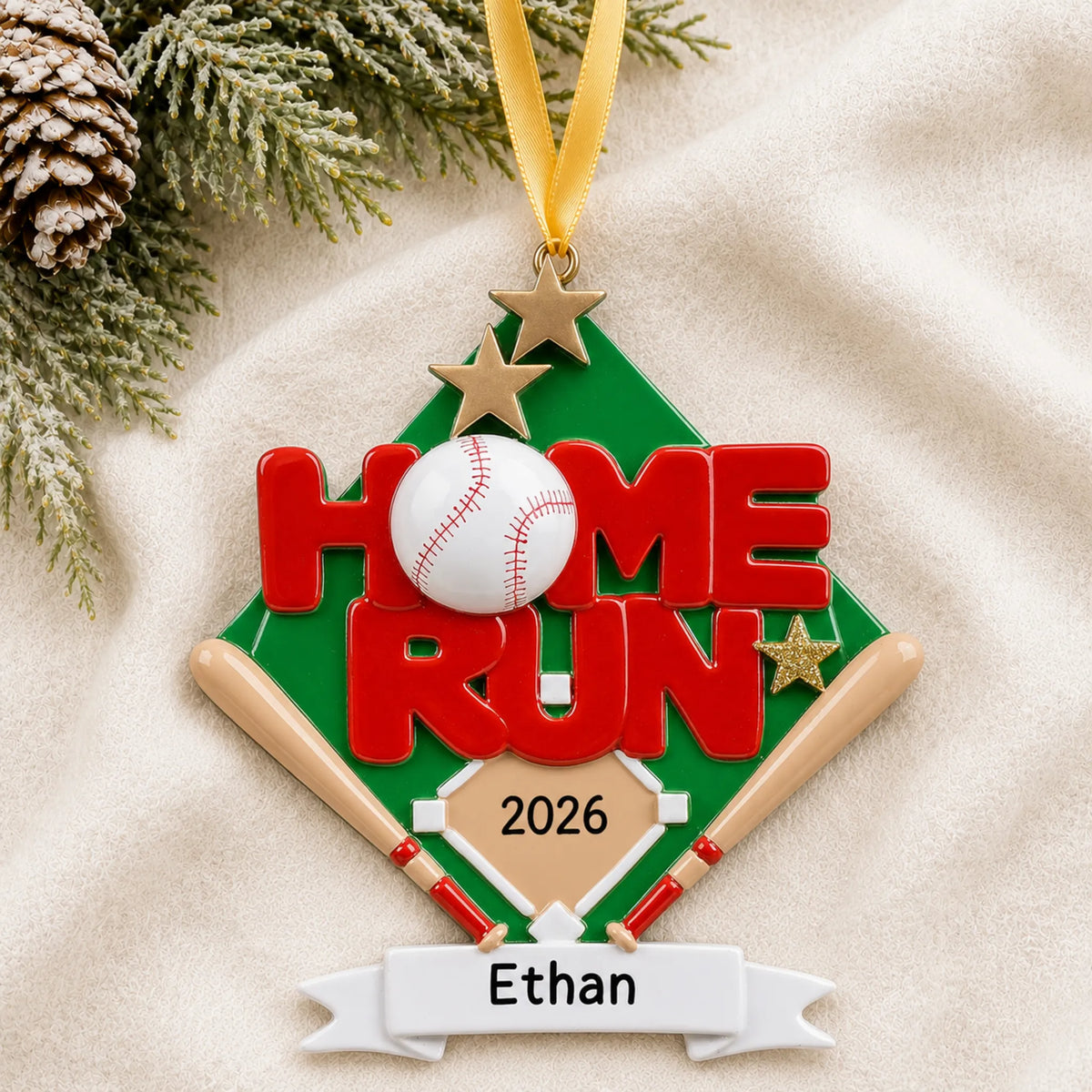 Personalized baseball home run christmas ornament laid on a soft white knit blanket