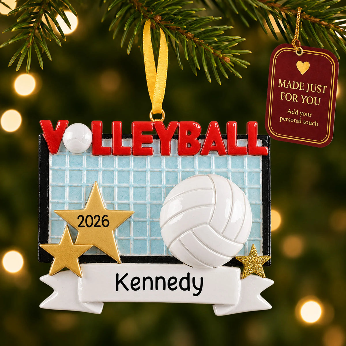 Volleyball banner christmas ornament hanging on a lit Christmas tree with a Made Just For You gift tag
