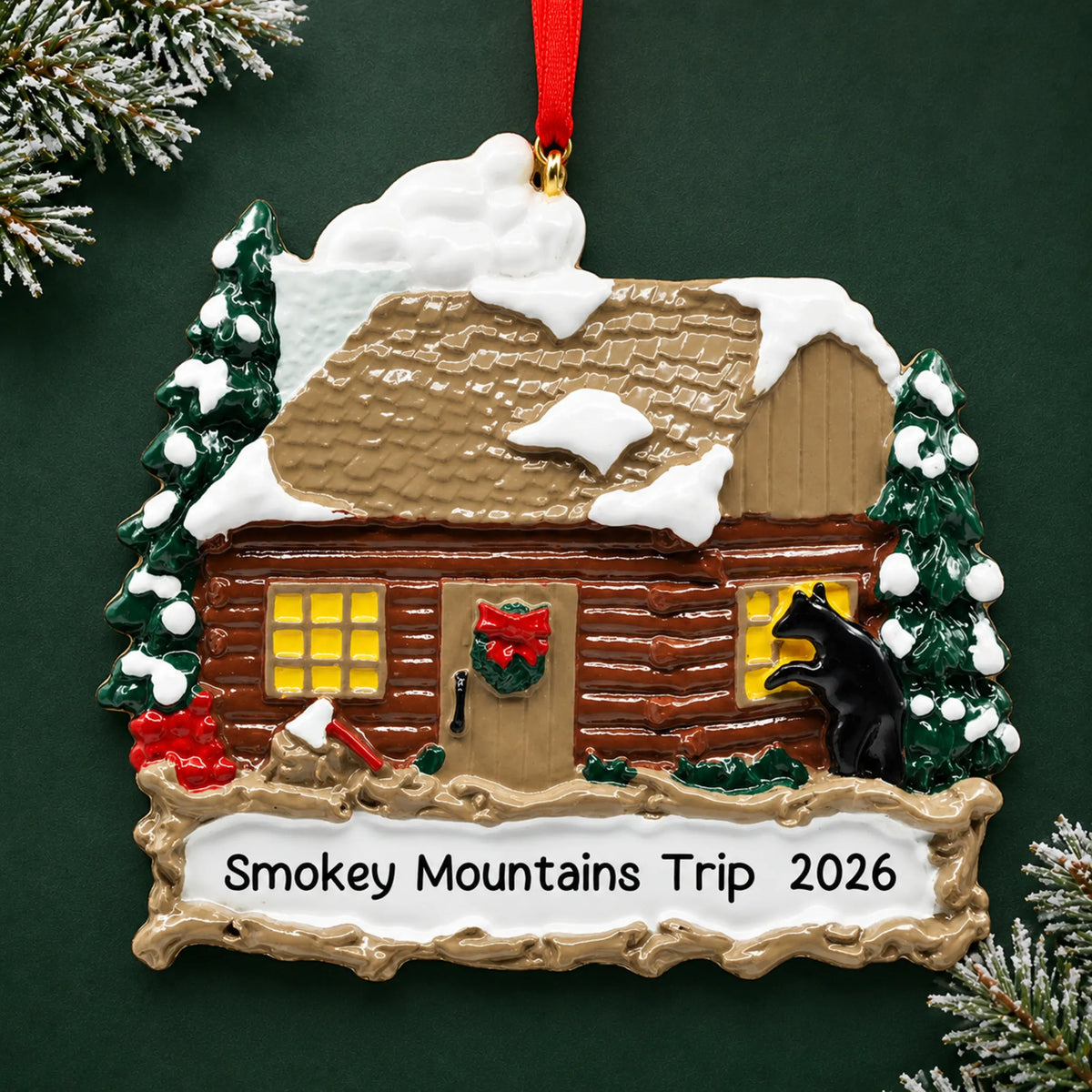 Personalized log cabin with banner christmas ornament on a dark green pine background
