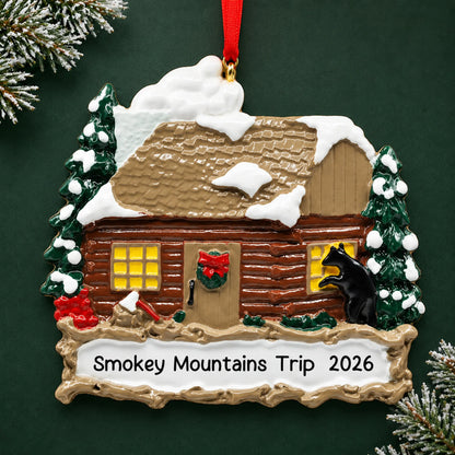 Personalized log cabin with banner christmas ornament on a dark green pine background