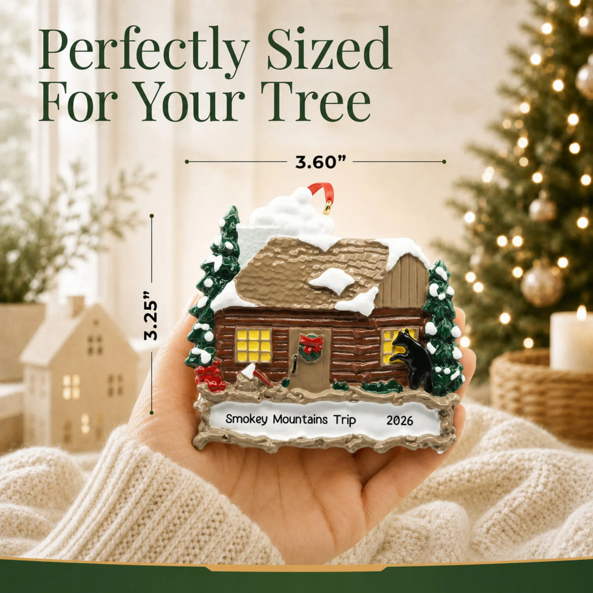 Size guide: the personalized log cabin with banner christmas ornament is 3.60 in wide by 3.25 in tall, shown in hand