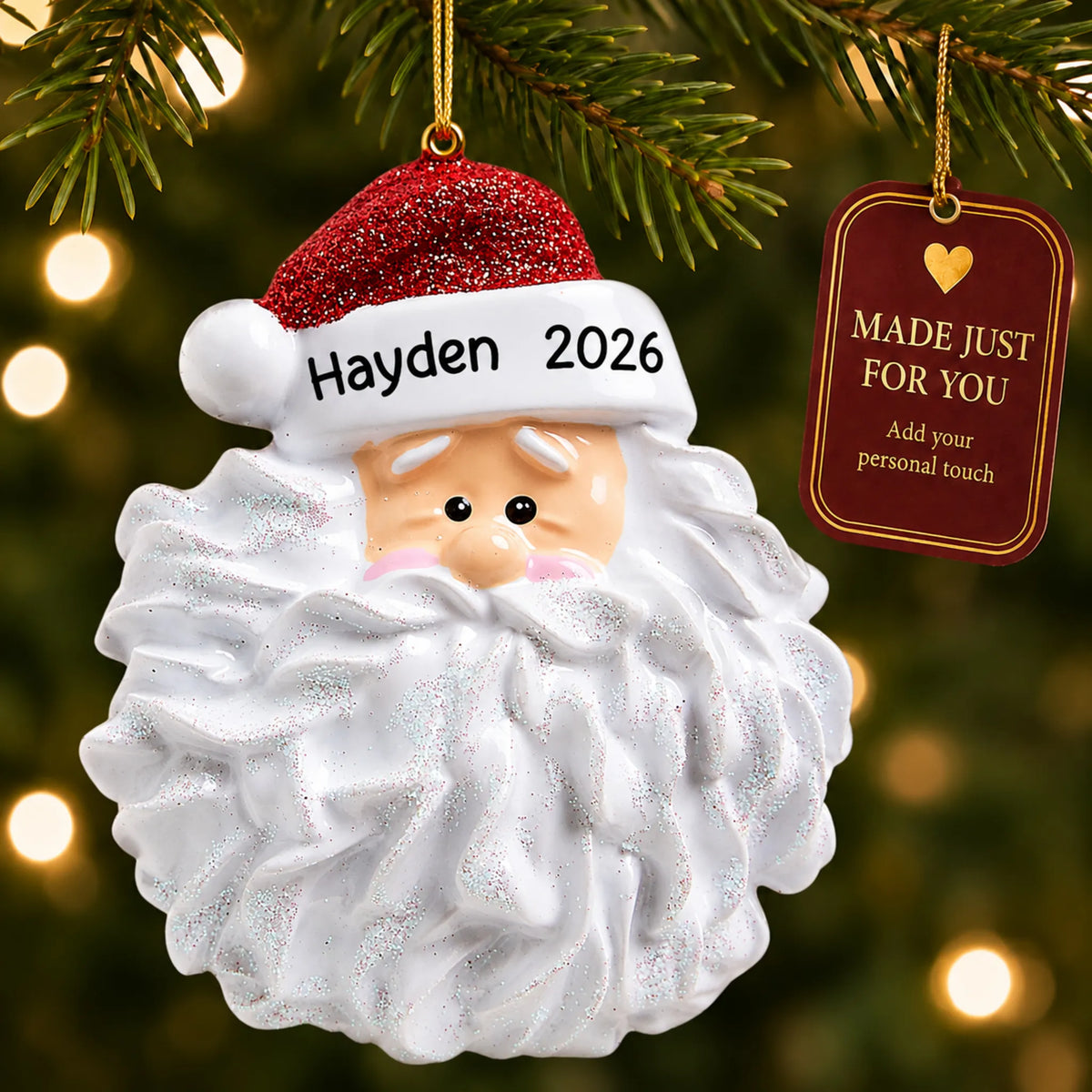Santa Glitter Beard christmas ornament hanging on a lit Christmas tree with a Made Just For You gift tag