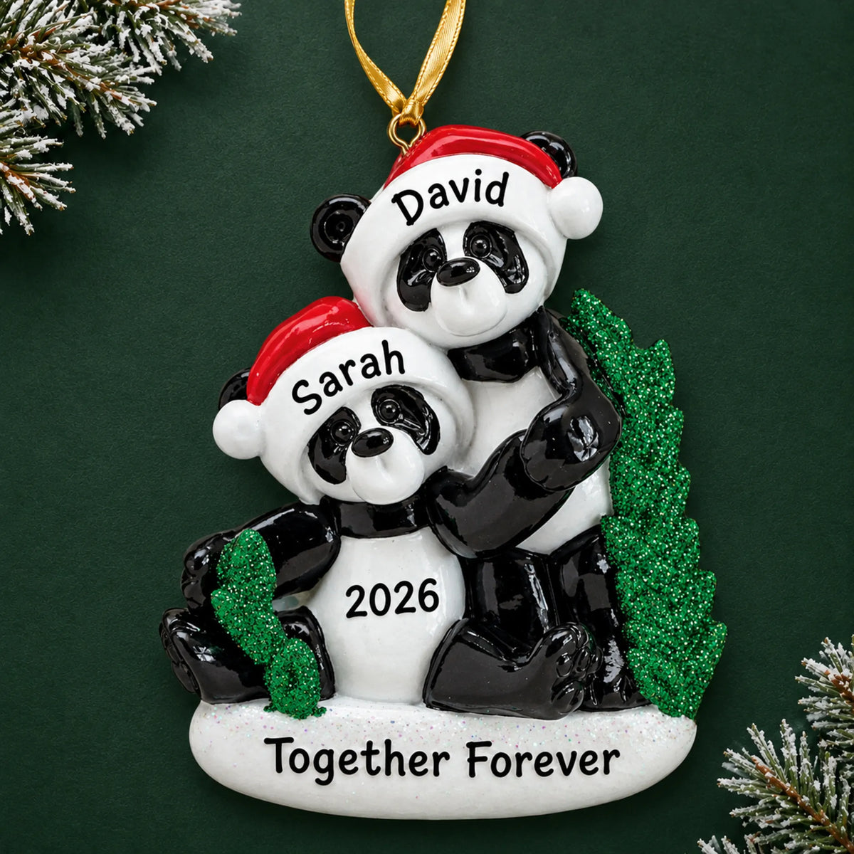 Personalized panda couple christmas ornament on a dark green pine background