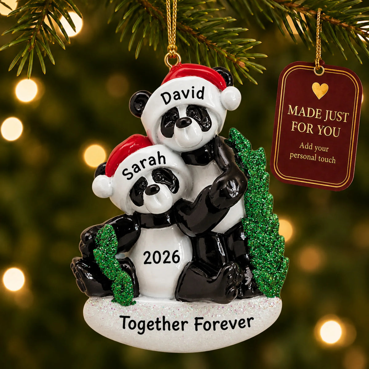 Panda couple christmas ornament hanging on a lit Christmas tree with a Made Just For You gift tag
