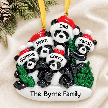 Personalized panda family of 5 christmas ornament laid on a soft white knit blanket