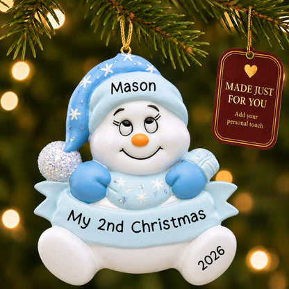 Baby boy 2nd christmas snowman ornament hanging on a lit Christmas tree with a Made Just For You gift tag