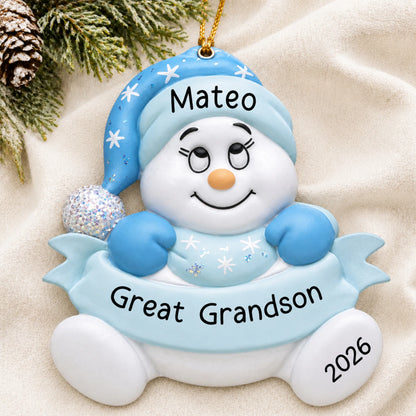 Personalized great grandson snowman christmas ornament laid on a soft white knit blanket