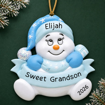 Personalized grandson snowman christmas ornament on a dark green pine background