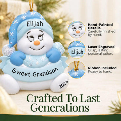 Hand-painted details and laser engraved personalization on the grandson snowman christmas ornament, ribbon included