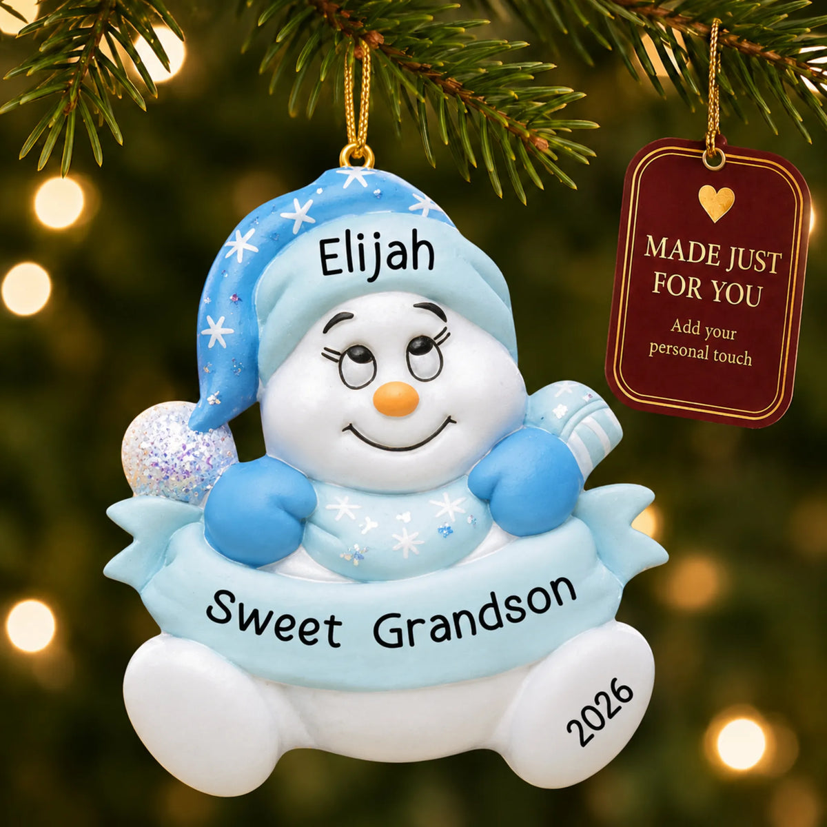 Grandson snowman christmas ornament hanging on a lit Christmas tree with a Made Just For You gift tag