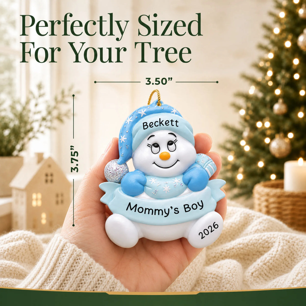 Size guide: the personalized mommy's boy snowman christmas ornament shown in hand next to a Christmas tree