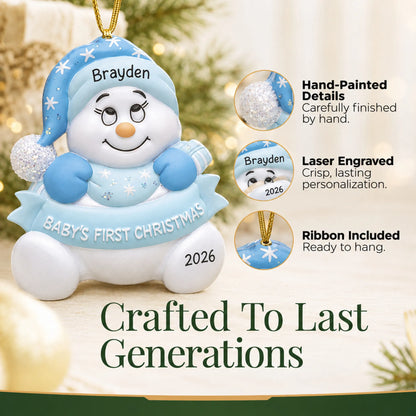 Hand-painted details and laser engraved personalization on the blue baby's 1st christmas snow baby ornament, ribbon included