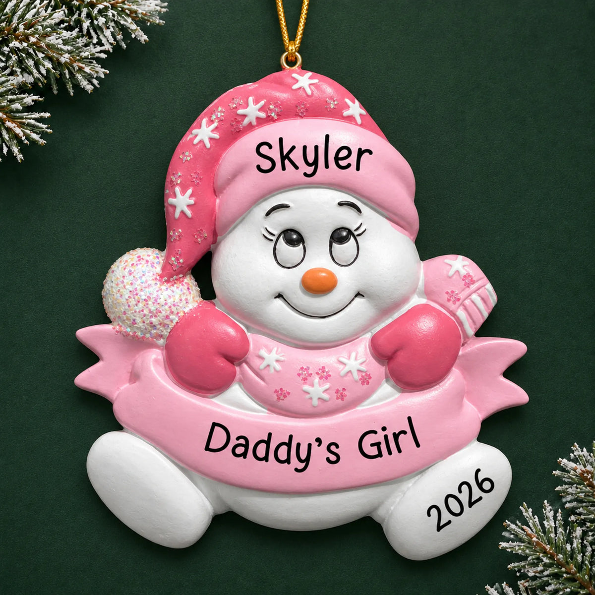 Personalized daddy's girl snowman christmas ornament on a dark green pine background
